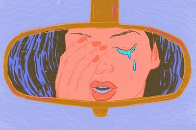 Teacher crying in the car.