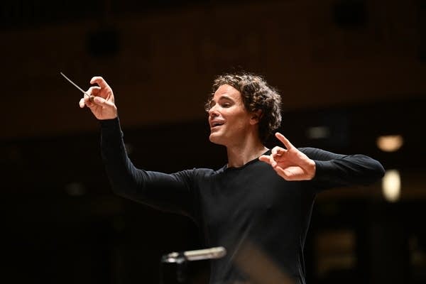 A man conducts an orchestra