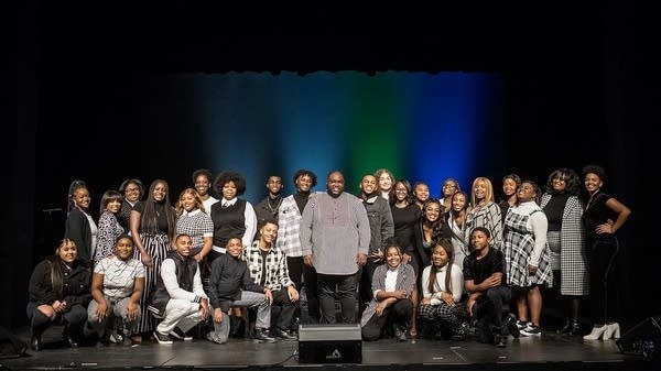 Courtland Pickens standing with youth choir