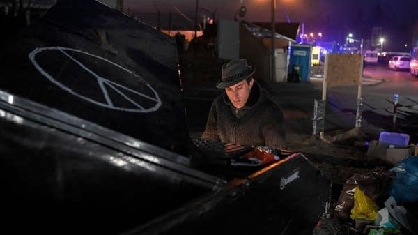 At one border crossing into Poland, those fleeing Ukraine are met with music