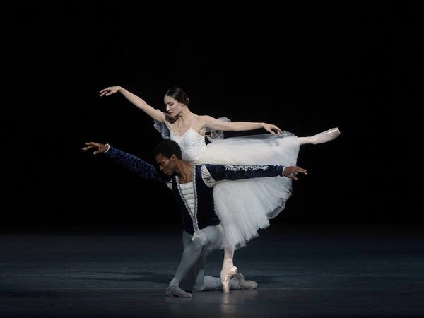Poster Two ballet dancers strike a dramatic pose during an onstage performance