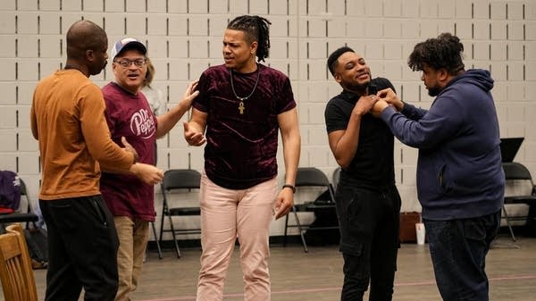 Poster Five men rehearse for 'The Central Park Five' opera