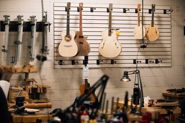 Guitars and mandolins in various stages of construction