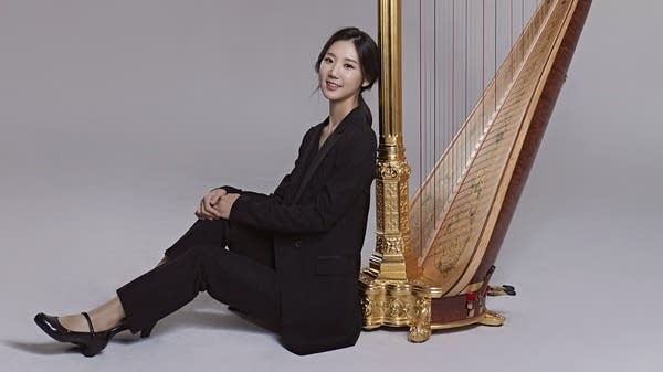 Poster Woman with a harp