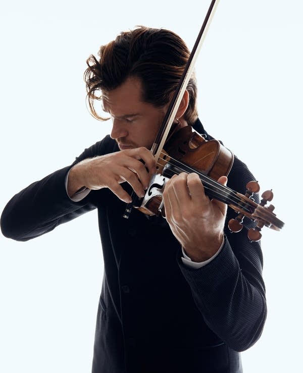 A musician plays a violin