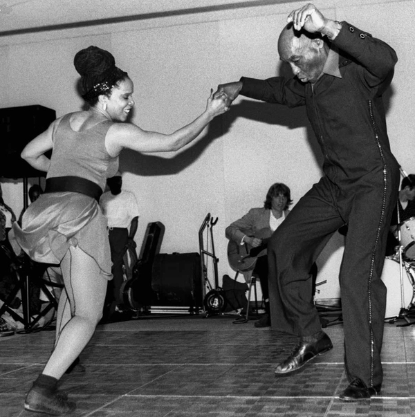 American dancers and choreographers Mickey Davidson (left) and 80-year-old Lindy Hop pioneer Frankie Manning (1914 - 2009) performing at Smithsonian, Madison Building, May 18, 1995.